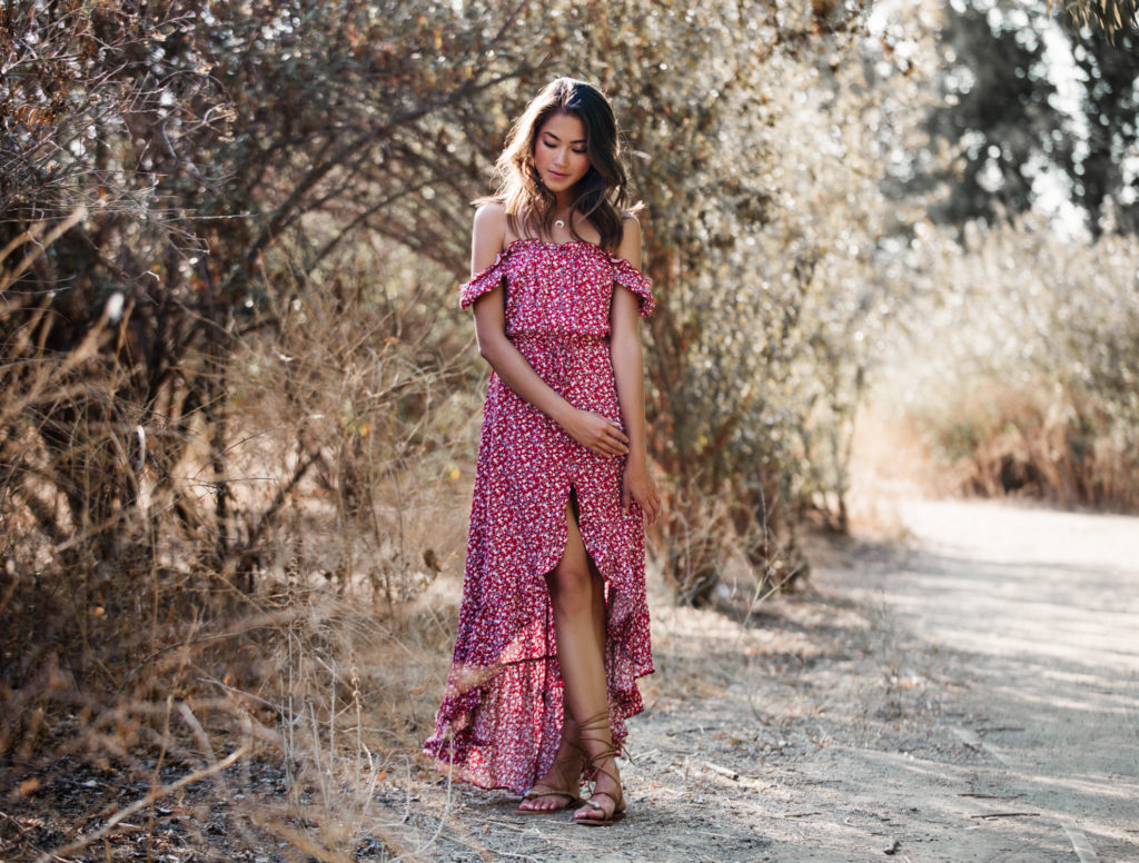 woman posing in the outdoors wearing off shoulder maxi dress