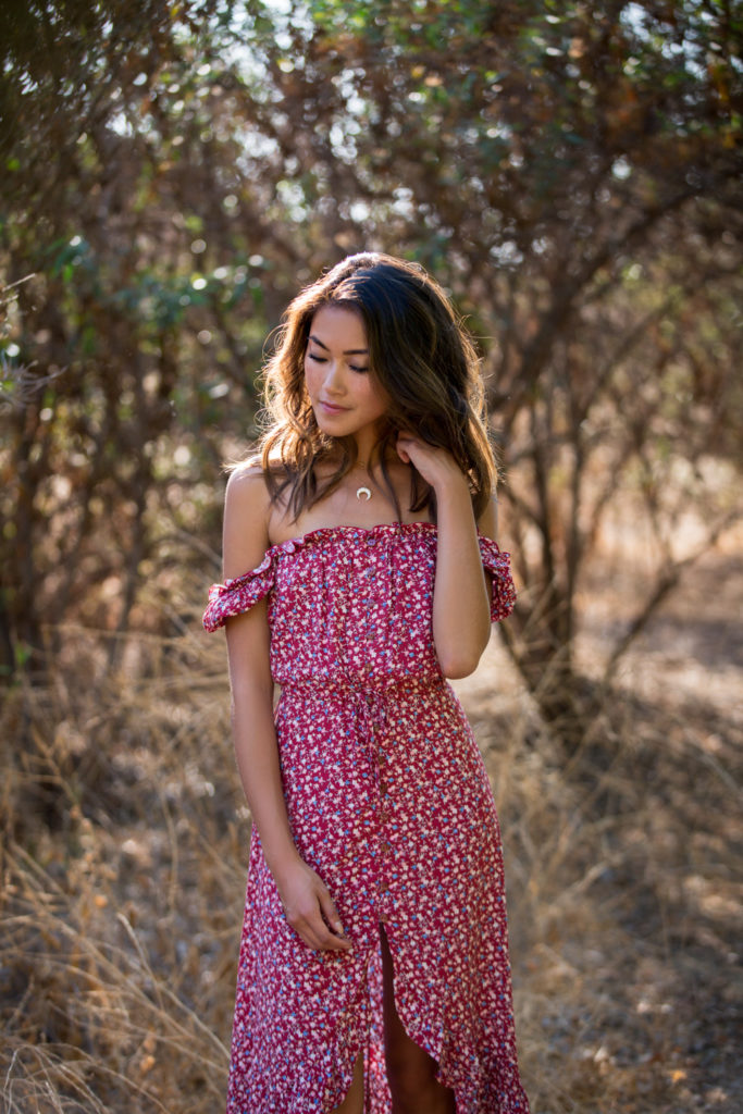 woman in the outdoors wearing off shoulder maxi dress