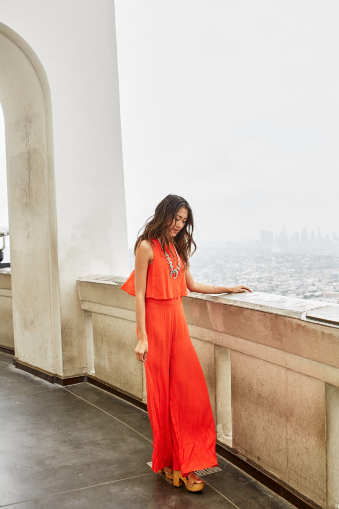 A preppy orange jumpsuit by The Luxi Look