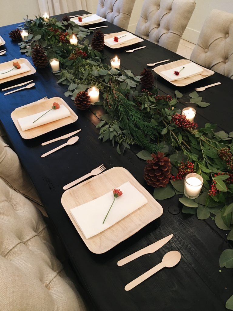 table setting on a black table for Thanksgiving 