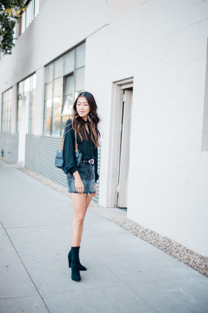 woman wearing black top and denim skirt and sharing Blogs Even Matter Anymore