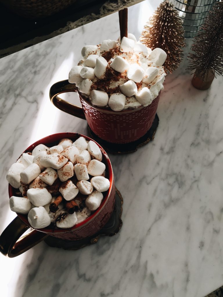 two mugs of Boozy Hot Chocolate on a countertop