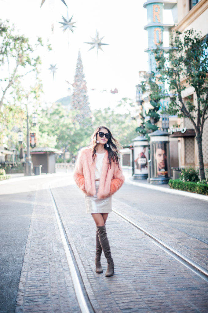 woman wearing skirt, shirt, and boots 