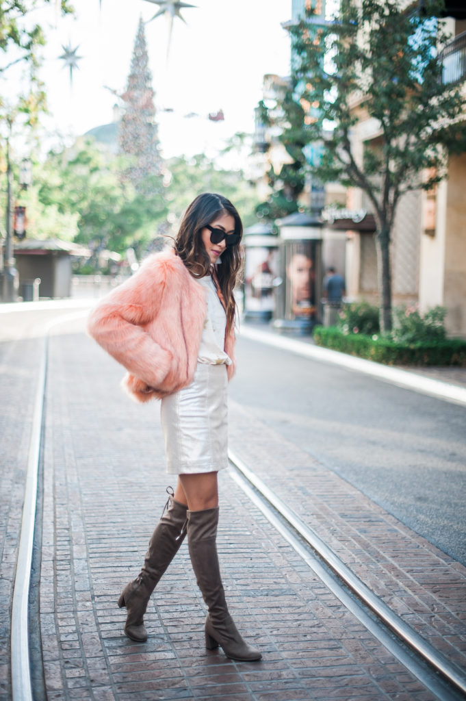 woman wearing faux fur jackets