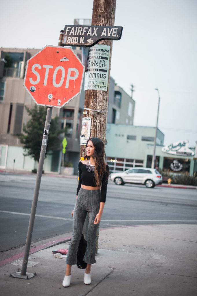 woman in the streets wearing Party Pants and black top