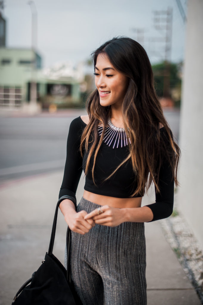 woman in pants and black top