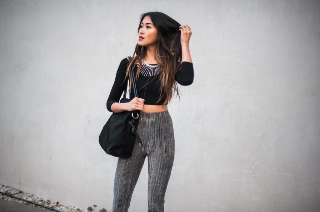 woman wearing Party Pants and black top