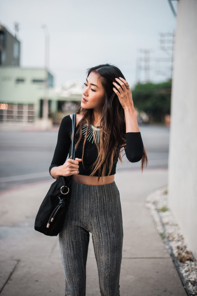 woman posing holding her hair