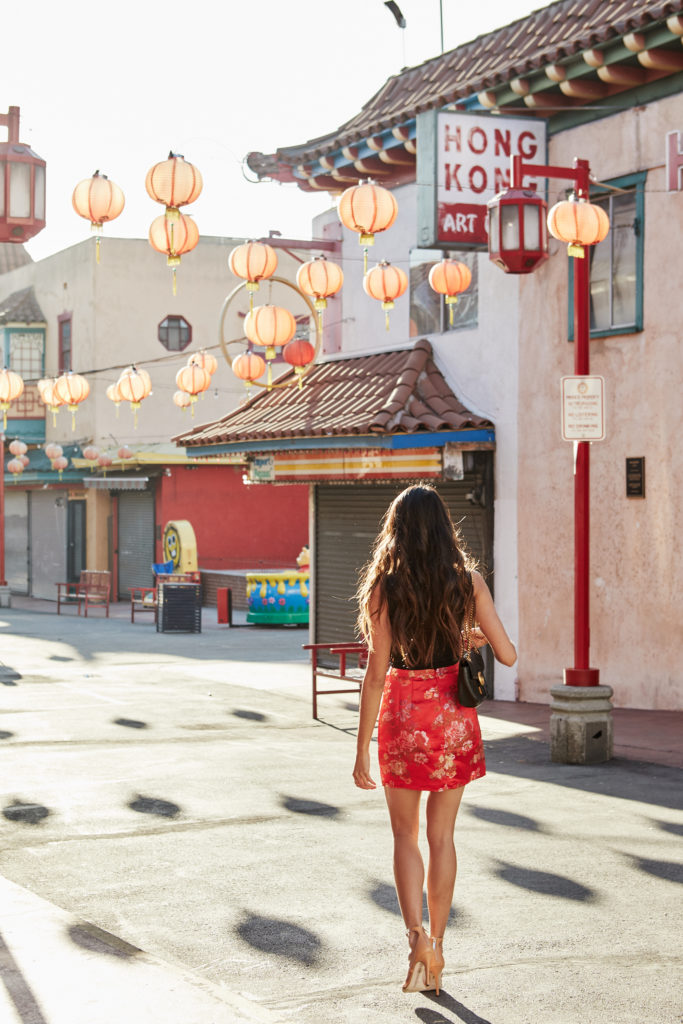 woman walking and celebrating Year of the Dog - Chinese New Year