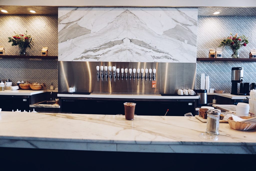 indoor of a coffee shop with white counter