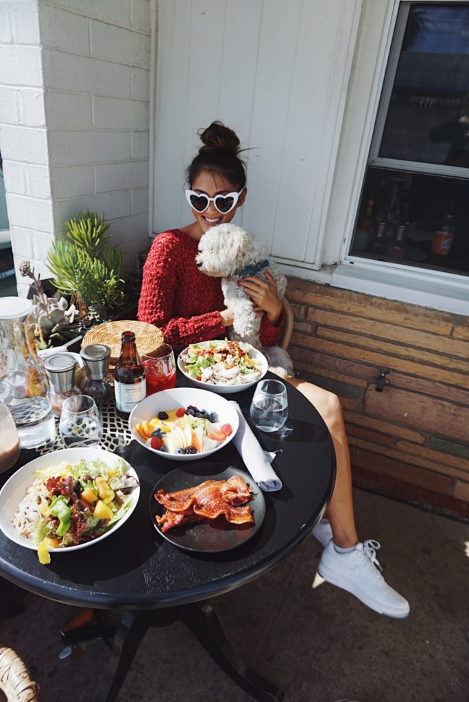 woman with her dog dining out for 72 Hours in San Diego 