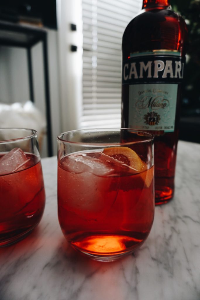 two glasses and a bottle of Cocktails with Campari