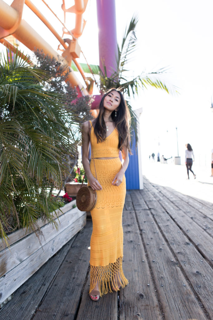 woman standing in yellow skirt and Crop Top 