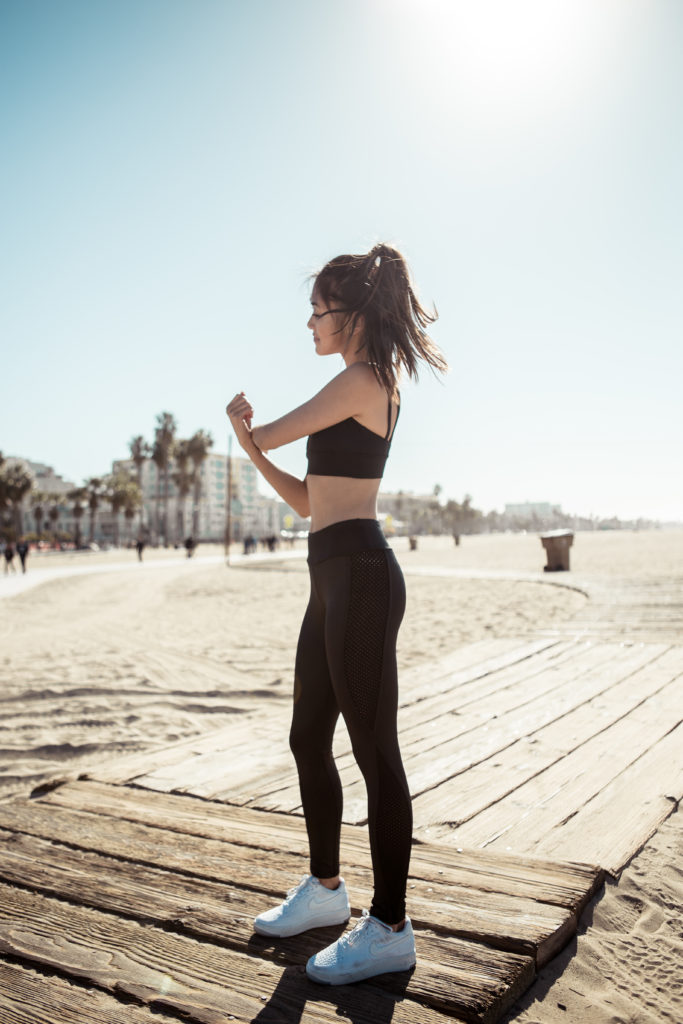 woman at the beach, exercising and showing How to Look and Feel Your Best