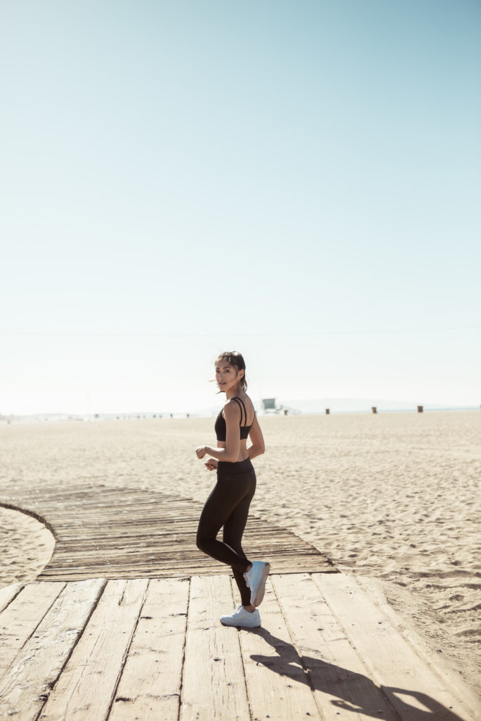 woman jogging at the beach showing How to Look and Feel Your Best