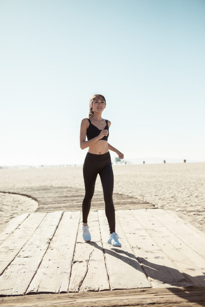 woman at the beach jogging to show How to Look and Feel Your Best