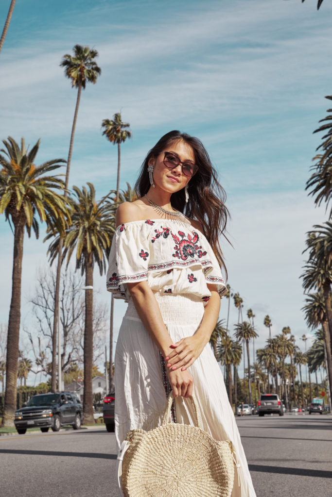 woman wearing white dress with print