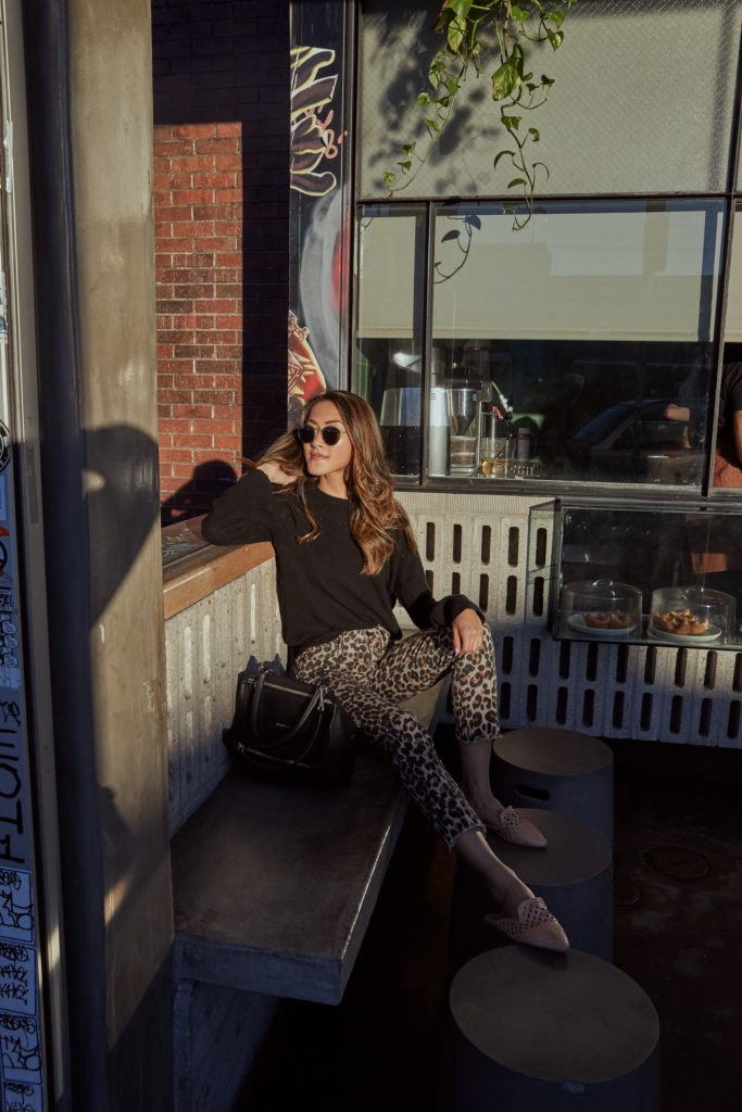 woman sitting outside a restaurant