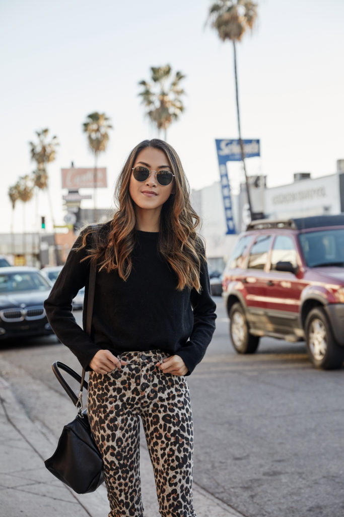 woman wearing Amy Zhang outfit details: sweater: equipment | pants: paige | bag: givenchy | sunnies: ray-ban by The Luxi Look