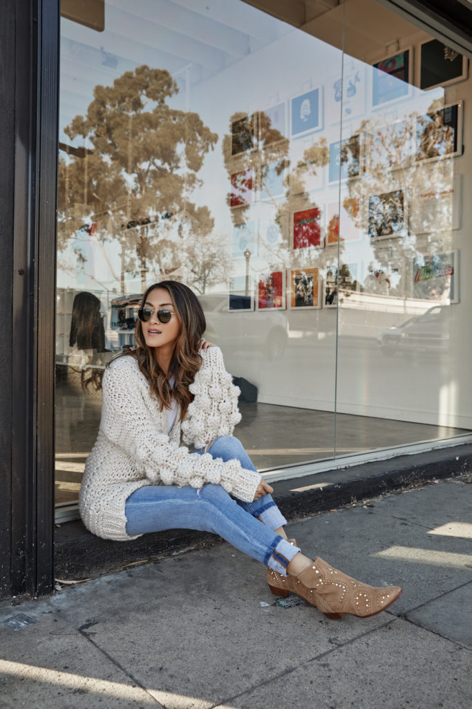 woman sitting outside a store and sharing How to Stay Grounded