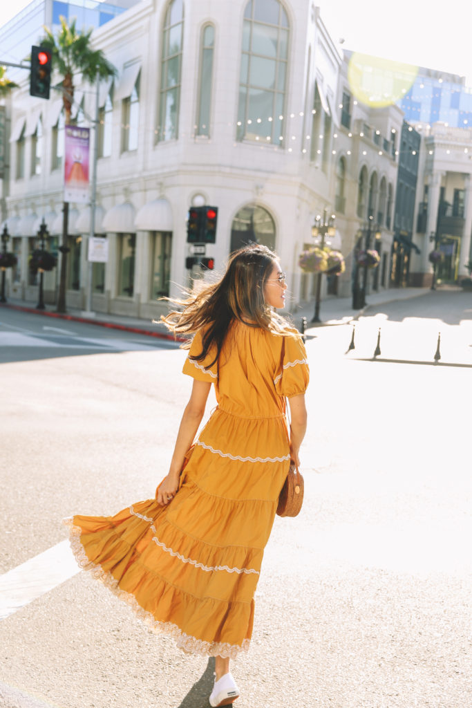 a girl in a yellow dress