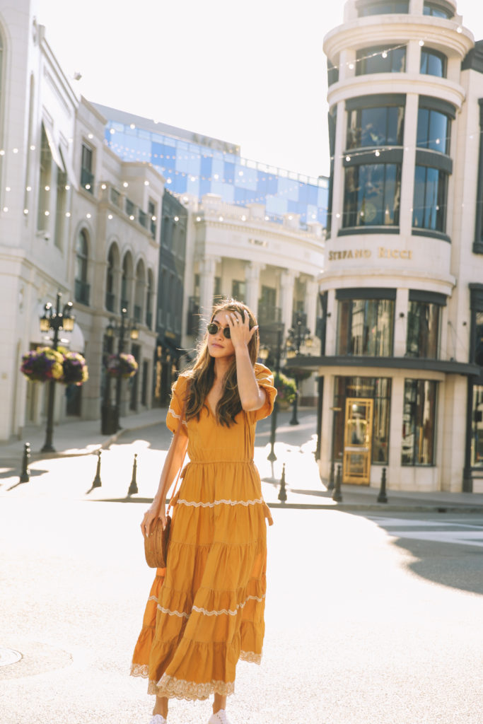 a girl on a dress in an outfit that is yellow