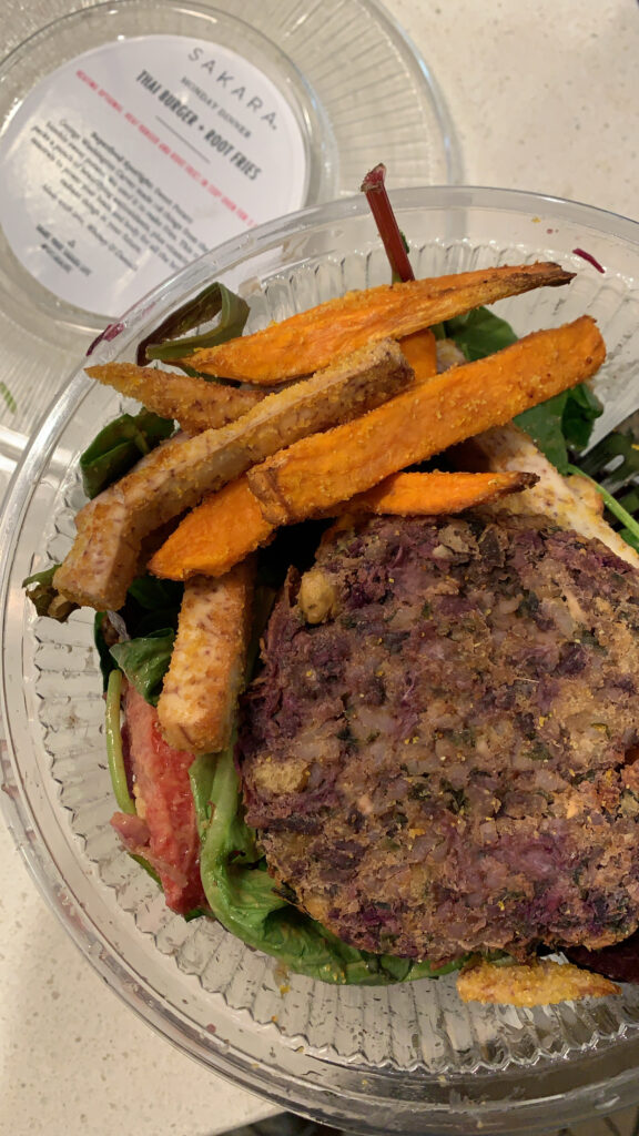 Thai veggie burger salad with root vegetable fries.