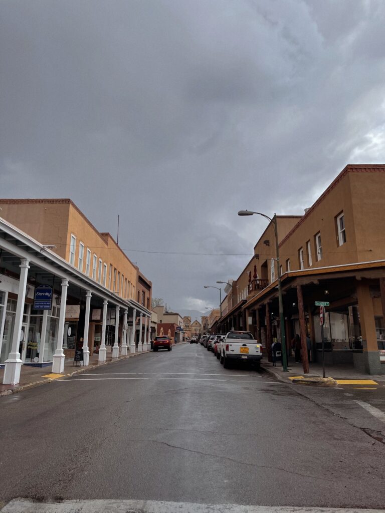 a road with buildings and cars 