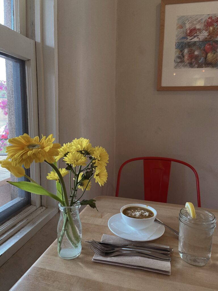 table with food and flowers on it 